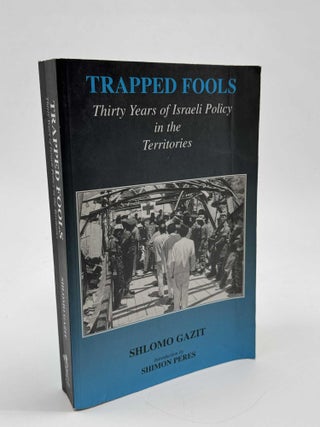 Item #102335 Trapped Fools: Thirty Years of Israeli Policy in the Territories. Shlomo Gazit,...